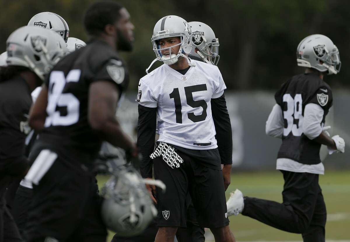 Michael Crabtree (15) watches his teammates work on sprint drills at the camp. The Oakland Raiders held a mini-camp at their practice facility at Alameda, Calif. Tuesday April 21, 2015.