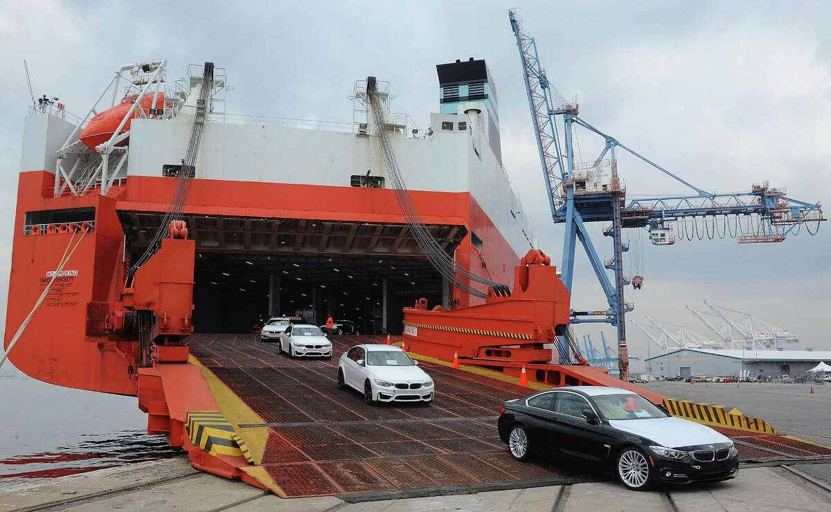 Cars come off a vessel in Baltimore last year during the official opening of BMW's vehicle distribution center in Baltimore. BMW Group broke ground Tuesday on a facility in Galveston.