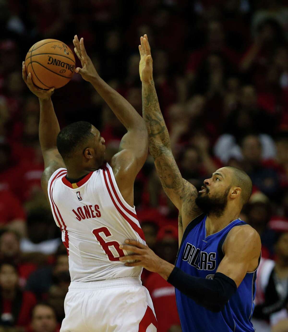 Houston Rockets forward Terrence Jones shoots over Dallas Mavericks center Tyson Chandler during the second half of the Western Conference Playoff game at the Toyota Center Saturday, April 18, 2015, in Houston. ( James Nielsen / Houston Chronicle )