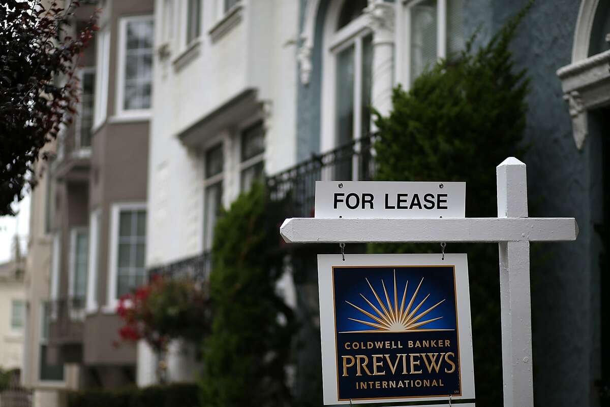 In this file photo, a for lease sign is posted in front of home for rent on April 21, 2015 in San Francisco, California. 