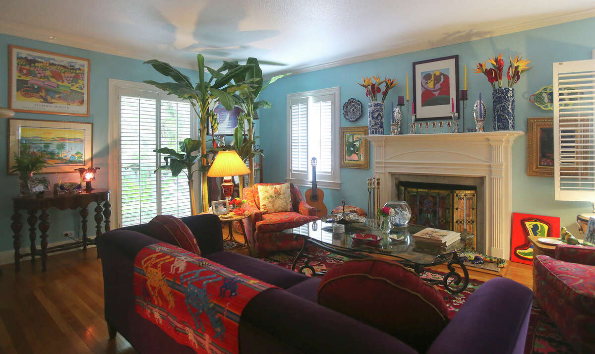 John and Lesley Neyland enjoy morning coffee in their living room, which reflects their love of color and their penchant for combining quirky finds into a comfortable aesthetic.