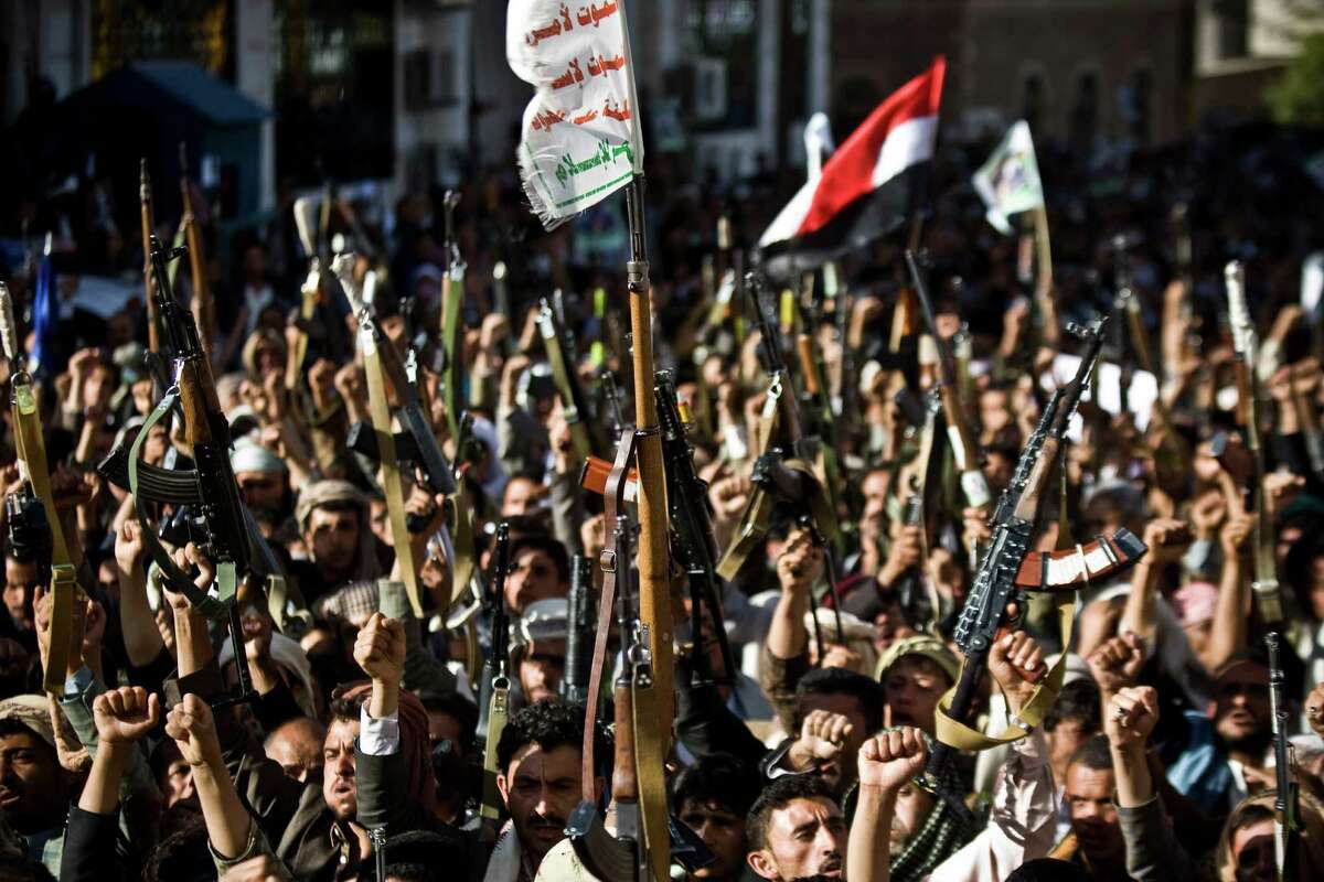 Shiite rebels known as Houthis hold up their weapons as they chant slogans during a protest to denounce the Saudi aggression in Sanaa, Yemen, Wednesday, April 22, 2015. Yemenâs Shiite rebels, who have taken over large parts of the country and have faced a Saudi-led air assault, said Wednesday they welcome United Nations-led talks to find a political solution to the conflict. (AP Photo/Hani Mohammed)