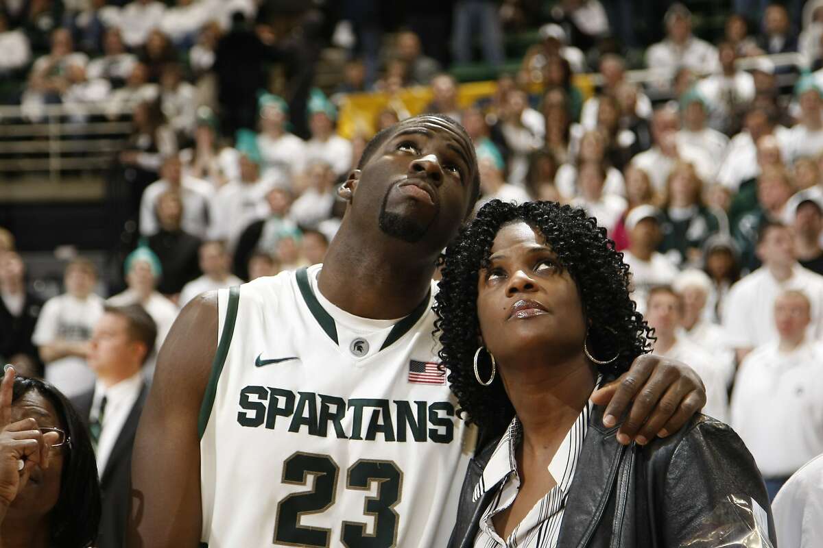 Draymond Green and his mother, Mary Babers-Green, participate in Senior Day ceremonies at Michigan State in East Lansing, Mich.