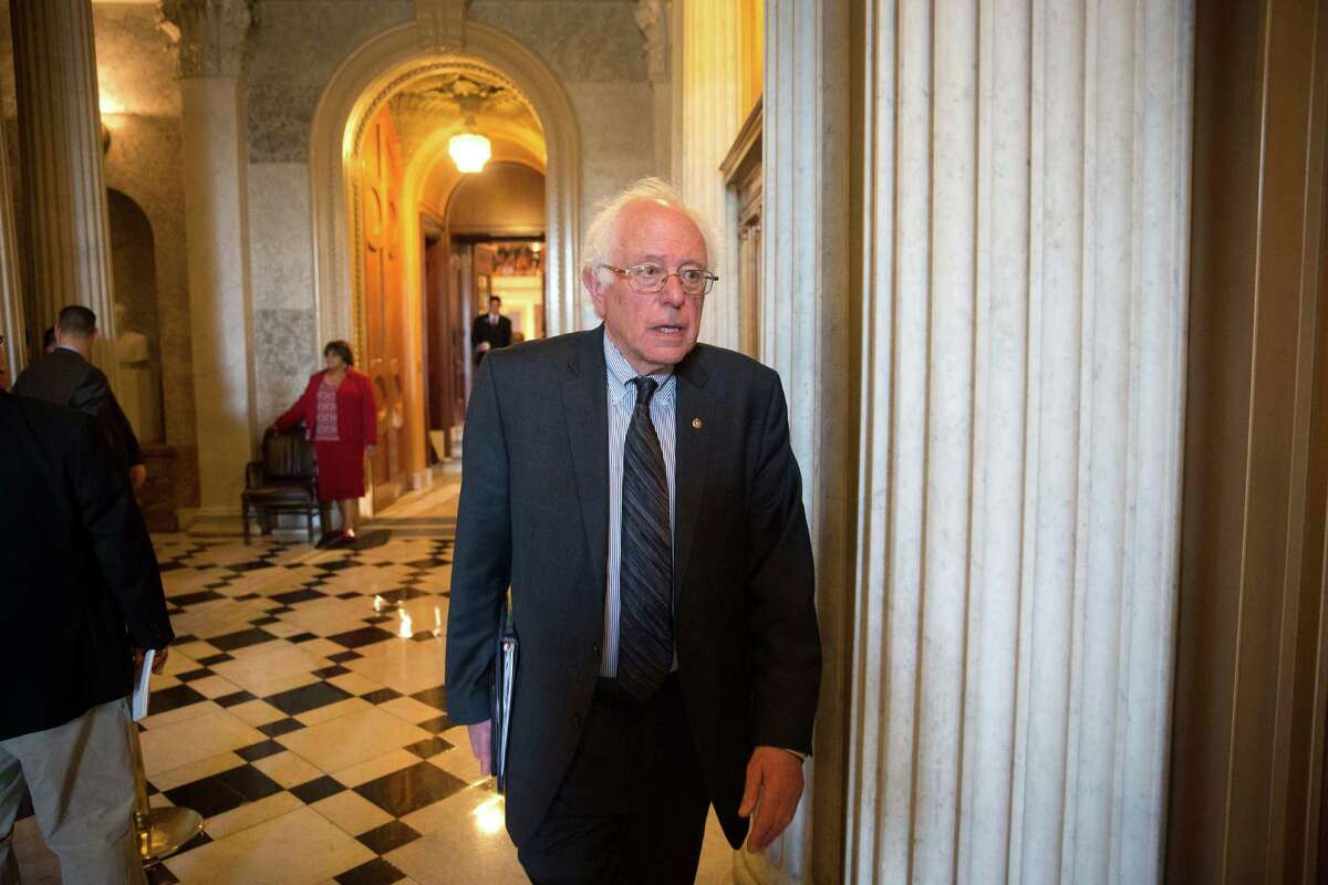 Sen. Bernie Sanders (i-Vt.) walks from the Senate Floor following the passage of a bill to fight human trafficking on Capitol Hill in Washington, April 22, 2015. Passage of the legislation, stalled over an anti-abortion provision, clears the way for the Senate to take up the confirmation of Loretta Lynch as attorney general. (Doug Mills/The New York Times)