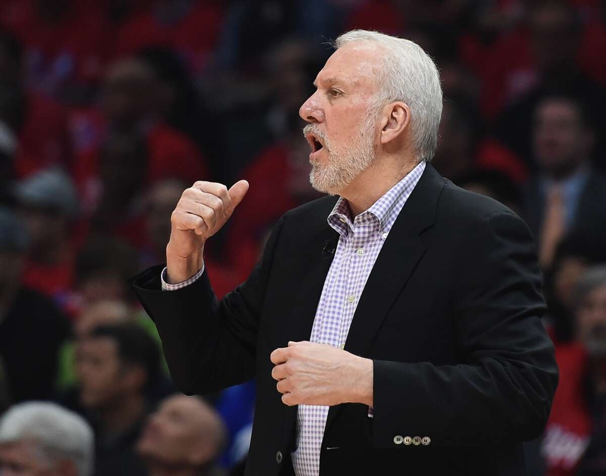 LOS ANGELES, CA - APRIL 22: Gregg Popovich of the San Antonio Spurs calls a play against the Los Angeles Clippers during the first half of Game Two of the Western Conference quarterfinals of the 2015 NBA Playoffs at Staples Center on April 22, 2015 in Los Angeles, California. NOTE TO USER: User expressly acknowledges and agrees that, by downloading and or using this Photograph, user is consenting to the terms and condition of the Getty Images License Agreement. (Photo by Harry How/Getty Images)