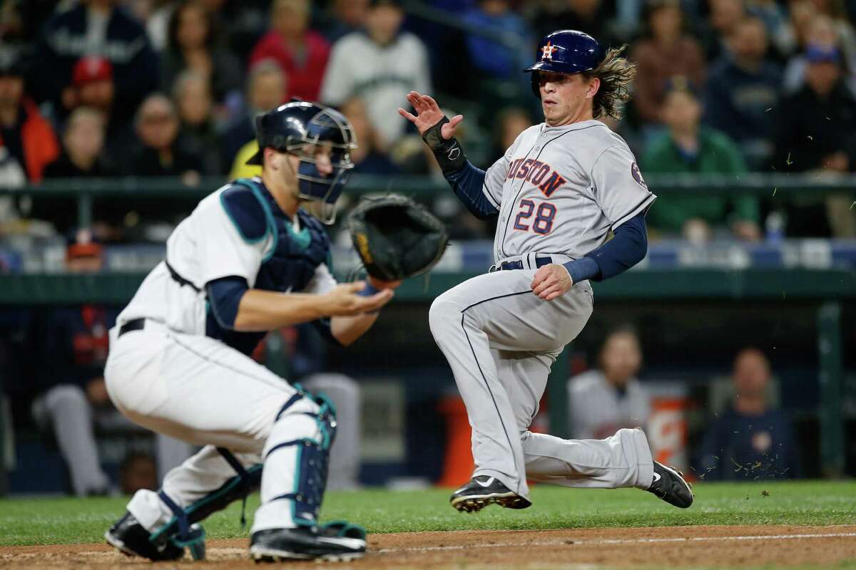 Colby Rasmus beats the throw to Mariners catcher Mike Zunino to score in the fifth inning Wednesday night.
