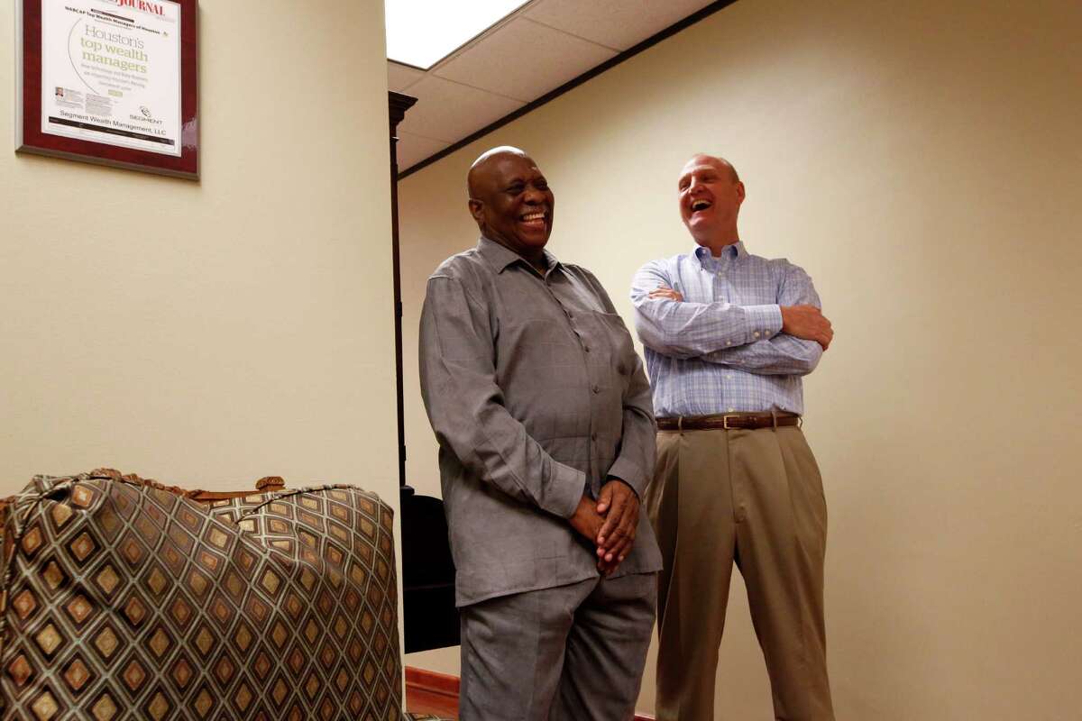 Retired teacher H.B. Taylor, left, and former student Gil Baumgarten trade stories. Recently Baumgarten sent Taylor on a two-week vacation to Greece as a way of saying thank you. (Eric Kayne/For the Chronicle)