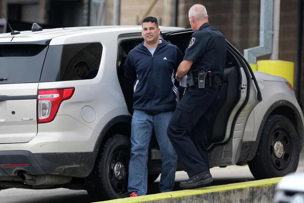 Leonardo Ramos,39, is escorted into the magistrate's office Thursday April 23, 2015. He faces a charge of indecency with a child. Ramos was teaching at the Jubilee Academic Center according to Bexar County Sheriff's spokesman James Keith.