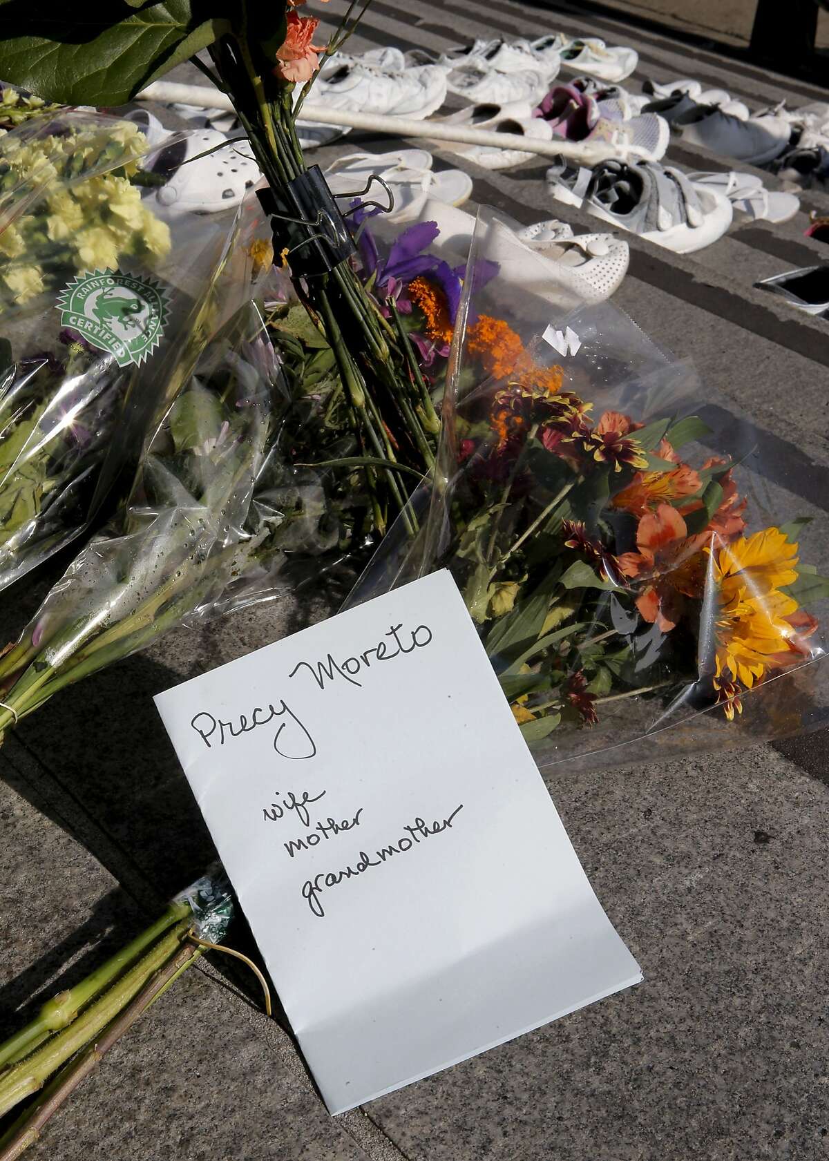 A note is placed along with flowers, on Friday Nov. 7, 2014, as members of San Francisco's Vision Zero Coalition gathered on the steps of City Hall in San Francisco, Calif. to draw attention to the alarming increase of traffic related deaths on the streets of the city in 2014.