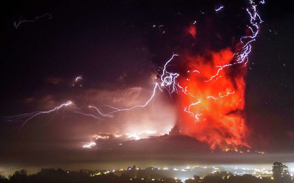 The Calbuco volcano erupts near Puerto Varas, Chile, Thursday, April 23, 2015. The volcano erupted Wednesday for the first time in more than 42 years, billowing a huge ash cloud over a sparsely populated, mountainous area in southern Chile, and is considered one of the top three most potentially dangerous among Chile's 90 active volcanos.(AP Photo/David Cortes Serey/ Agencia Uno) CHILE OUT - NO USAR EN CHILE