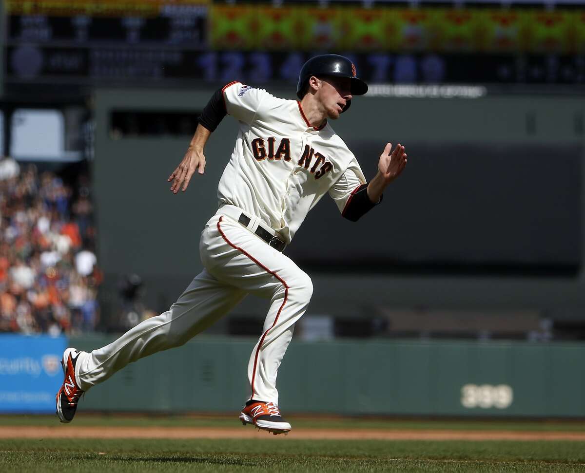San Francisco Giants' Matt Duffy scores on Brandon Crawford's game-tying RBI triple in 9th inning against Los Angeles Dodgers in MLB game at AT&T Park in San Francisco, Calif., on Thursday, April 23, 2015.