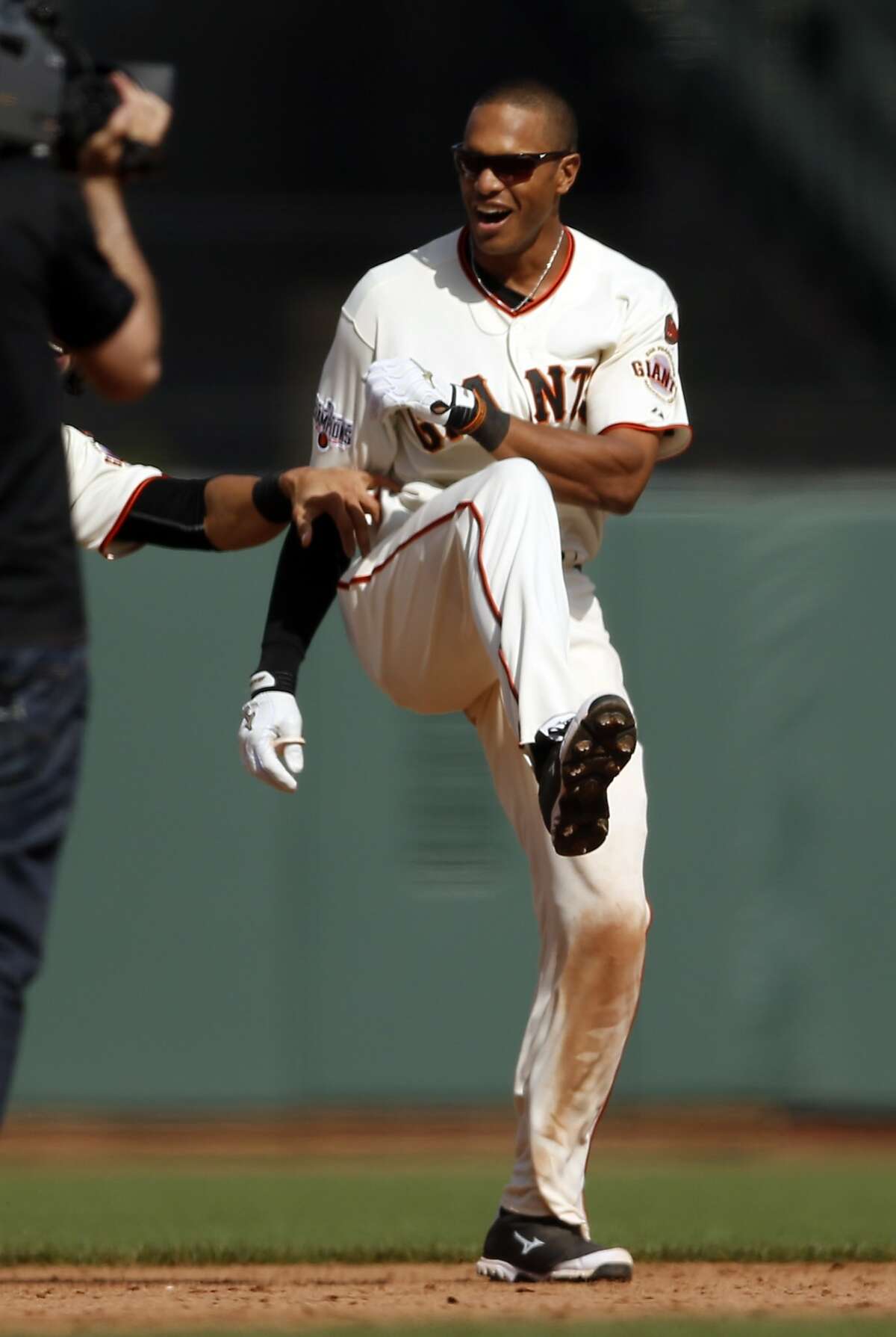 San Francisco Giants' Justin Maxwell celebrates his game-winning single in 10th inning of 3-2 win over Los Angeles Dodgers in MLB game at AT&T Park in San Francisco, Calif., on Thursday, April 23, 2015.