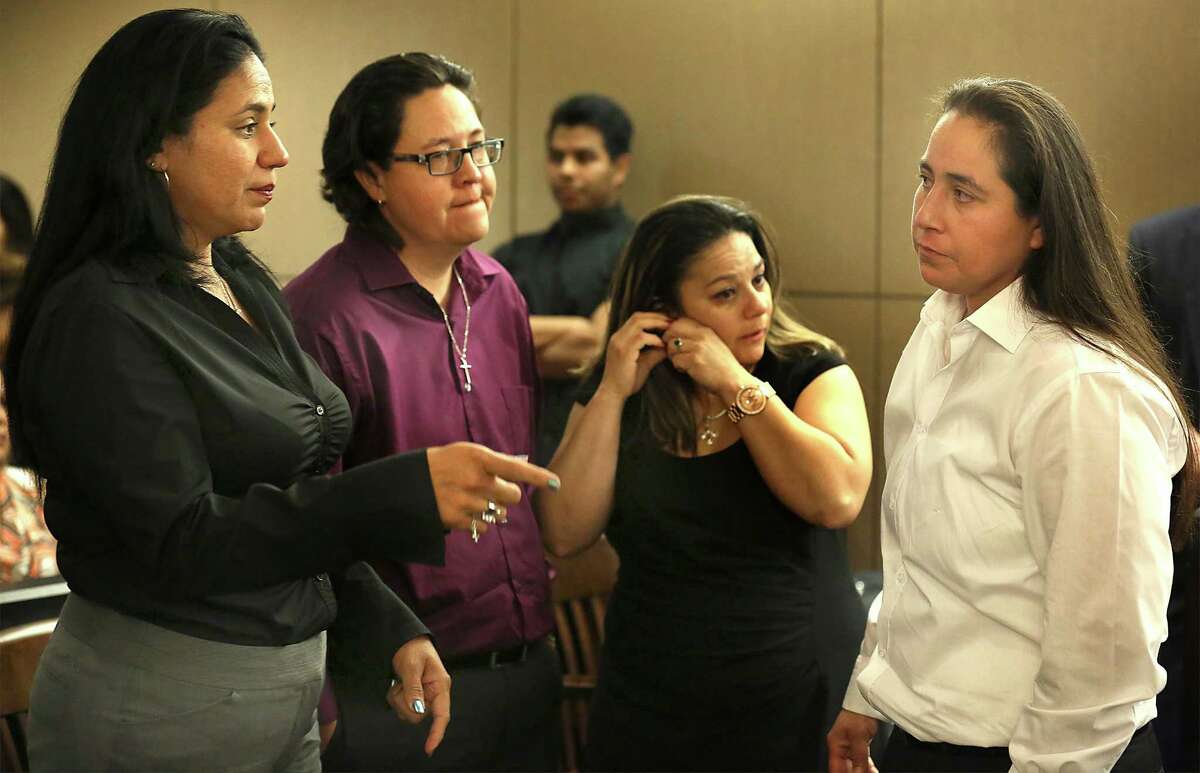 The SA Four, Cassandra Rivera, from left, Kristie Mayhugh, Elizabeth Ramirez, and Anna Vasquez, gather to talk at the end of the hearing in Bexar County Court to determine if they should be declared actually innocent of a sexual crime that they were found guilty of, or possibly sent back to prison. Thursday, April 23, 2015.