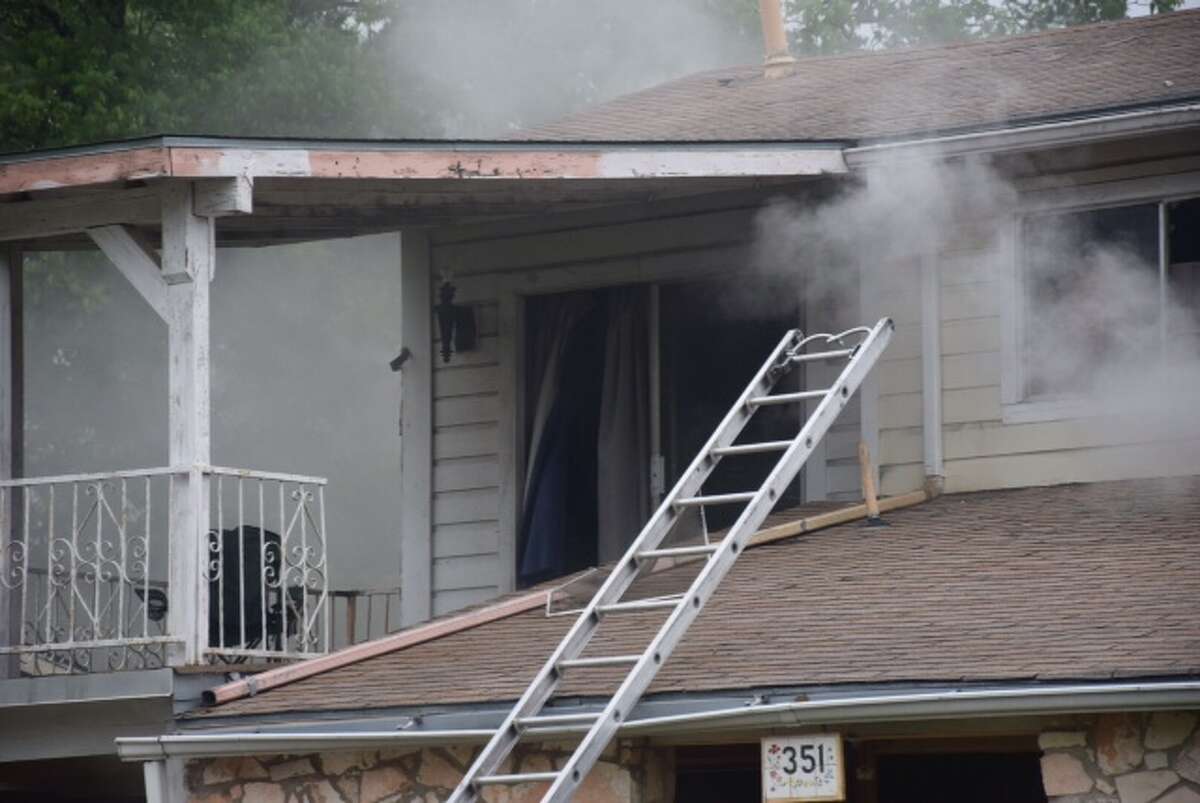 San Antonio Fire Department crews are working to extinguish a house fire in the 300 block of East Ackard place on April 24, 2015.