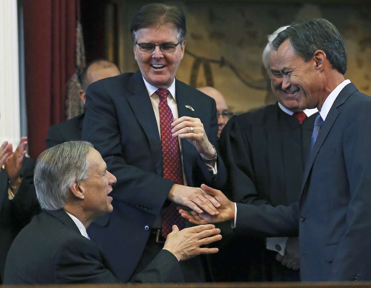Joe Straus accepts congratulations from Governor elect Greg Abbott and Lt. Governor elect Dan Patrick after being sworn in as Speaker of the House during the opening of the 2015 Legislature at the State Capitol on January 13, 2015.