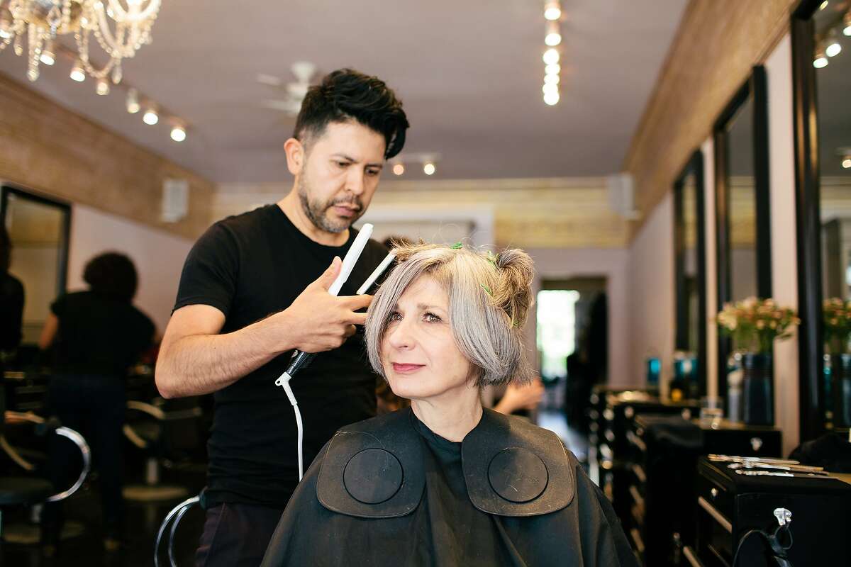 Pirkko Lucchesi has her hair cut by Hector Estrada at Rubio and Raven Salon, San Francisco, Calif., April 24, 2015.