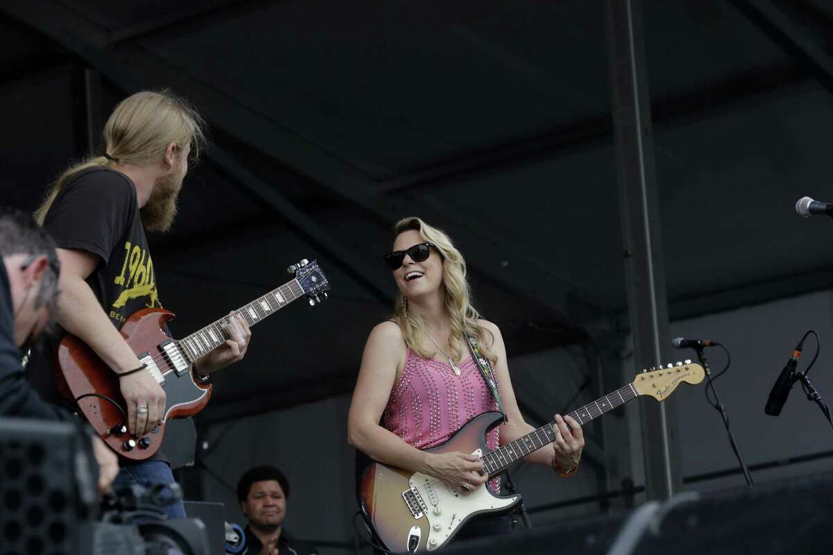 Derek Trucks and Susan Tedeschi perform with the Tedeschi Trucks Band at the New Orleans Jazz and Heritage Festival in New Orleans, Friday, April 24, 2015. (AP Photo/Gerald Herbert)