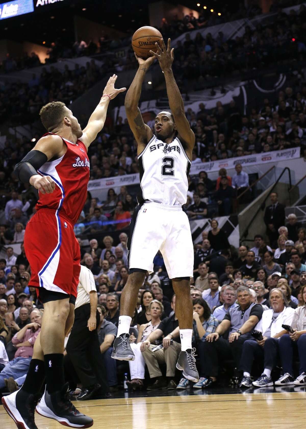 SAN ANTONIO, TX - APRIL 24: Kawhi Leonard #2 of the San Antonio Spurs shoots over Blake Griffin #32 of the Los Angeles Clippers in Game Three during the first round of the 2015 NBA Playoffs at the AT&T Center on April 24, 2015 in San Antonio, Texas. NOTE TO USER: User expressly acknowledges and agrees that, by downloading to the terms and conditions of the Getty Images License Agreement. (Photo by Chris Covatta/Getty Images)