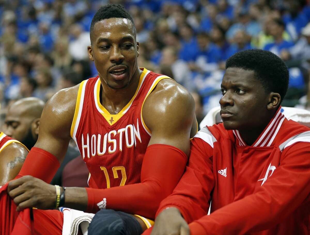 Houston Rockets center Dwight Howard left, speaks with teammate Clint Capela during the first half of Game 3 in the first round of NBA basketball playoffs at the American Airlines Center Friday, April 24, 2015, in Dallas. ( James Nielsen / Houston Chronicle )
