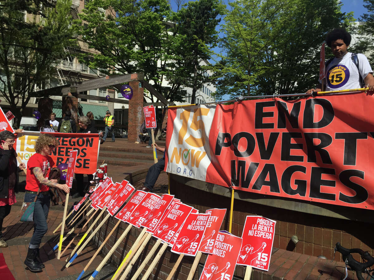 Hundreds of people march to support the movement to raise the minimum wage to $15 per hour in Portland, Ore., April 15. The “Fight for $15” campaign to win higher pay and a union for fast-food workers is expanding to represent a variety of low-wage workers and become more of a social justice movement.