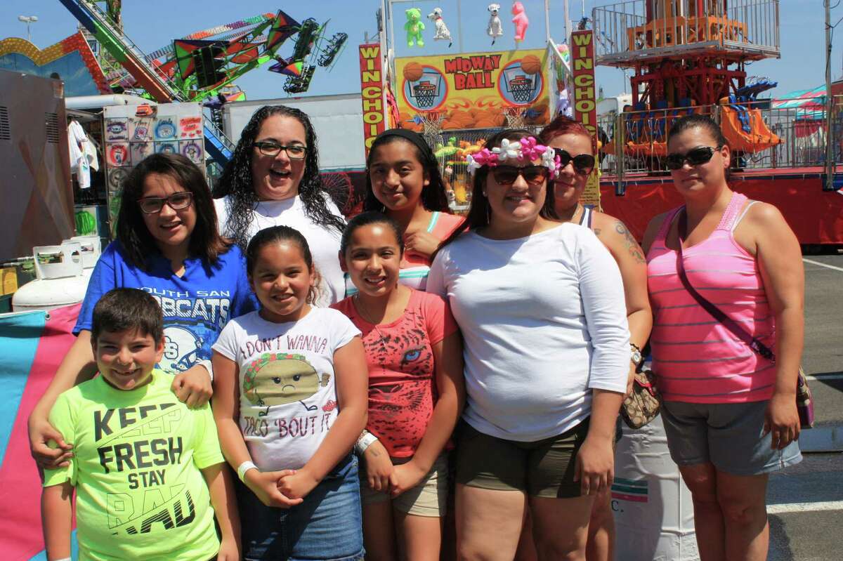 With the morning storms long gone and the weather finally cooperating, Fiesta partiers hit the carnival at the Alamodome Saturday with a passion.