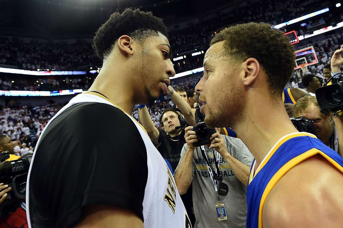 NEW ORLEANS, LA - APRIL 25: Anthony Davis #23 of the New Orleans Pelicans and Stephen Curry #30 of the Golden State Warriors speak at midcourt following Game Four in the first round of the 2015 NBA Playoffs at the Smoothie King Center on April 25, 2015 in New Orleans, Louisiana. NOTE TO USER: User expressly acknowledges and agrees that, by downloading and or using this photograph, User is consenting to the terms and conditions of the Getty Images License Agreement. (Photo by Stacy Revere/Getty Images)