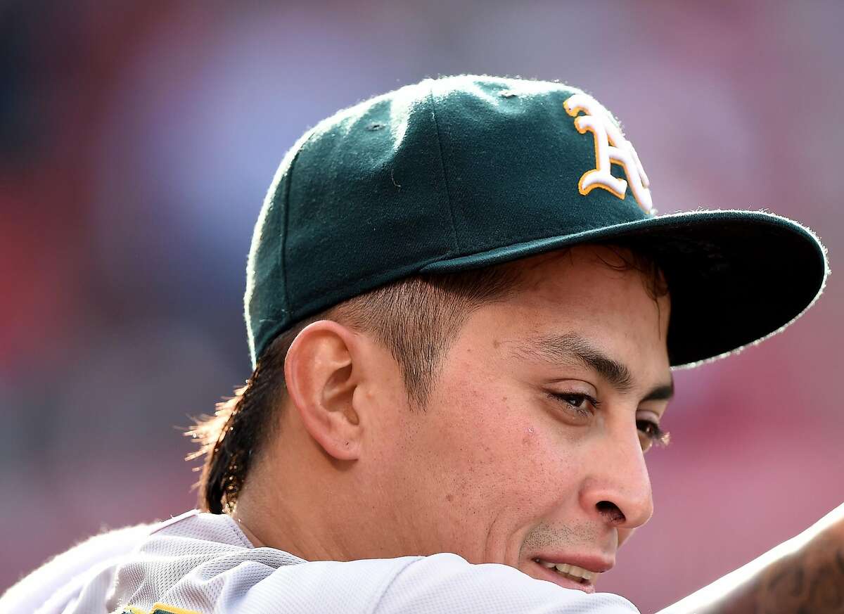 ANAHEIM, CA - APRIL 23: Jesse Chavez #30 of the Oakland Athletics watches play from the dugout during the bottom of the bottom of the sixth inning against the Los Angeles Angels at Angel Stadium of Anaheim on April 23, 2015 in Anaheim, California. (Photo by Harry How/Getty Images)