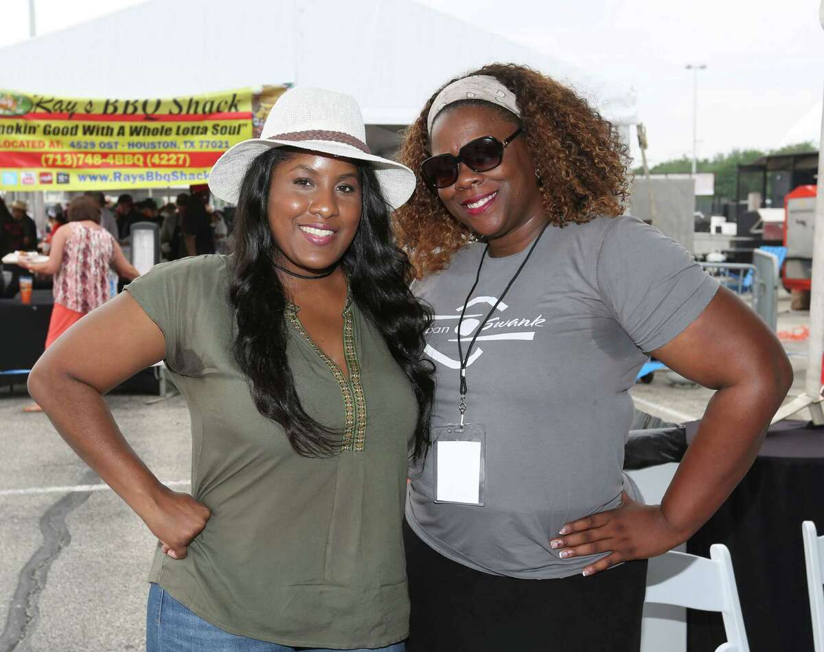 Guests pose for a photo at the 3rd annual Houston Barbecue Festival Sunday, April 26, 2015, at NRG Park.