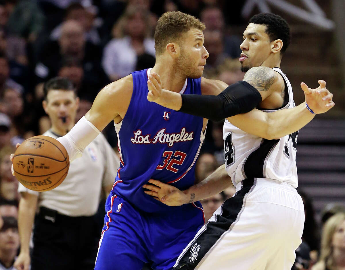Los Angeles Clippers' Blake Griffin looks for room around San Antonio Spurs' Danny Green during second half action of Game 4 in the Western Conference playoffs Sunday April 26, 2015 at the AT&T Center. The Clippers won 114-105.