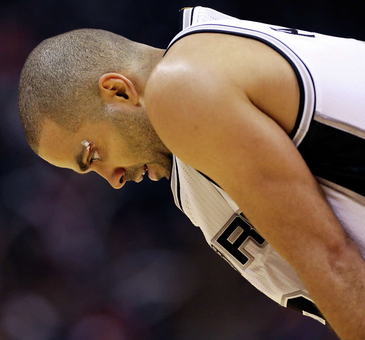 San Antonio Spurs' Tony Parker pauses during a timeout in second half action of Game 4 in the Western Conference playoffs against the Los Angeles Clippers Sunday April 26, 2015 at the AT&T Center. The Clippers won 114-105.