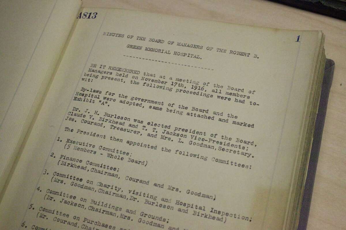 Minutes from the Robert B. Green Memorial Hospital’s Board of Managers’ meeting on Nov. 17, 1916 are seen in a book kept in University Health System’s archives.