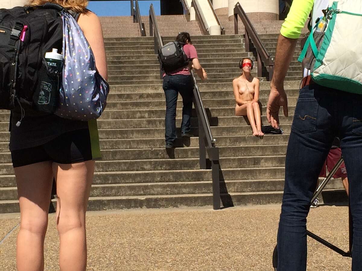 The sight of a nearly naked, blindfolded student outside the Texas State University library created a social media buzz within the Bobcat community. Monika Rostvold wore nothing but a nude-colored thong and pasties for an art project focusing on the objectification of women.