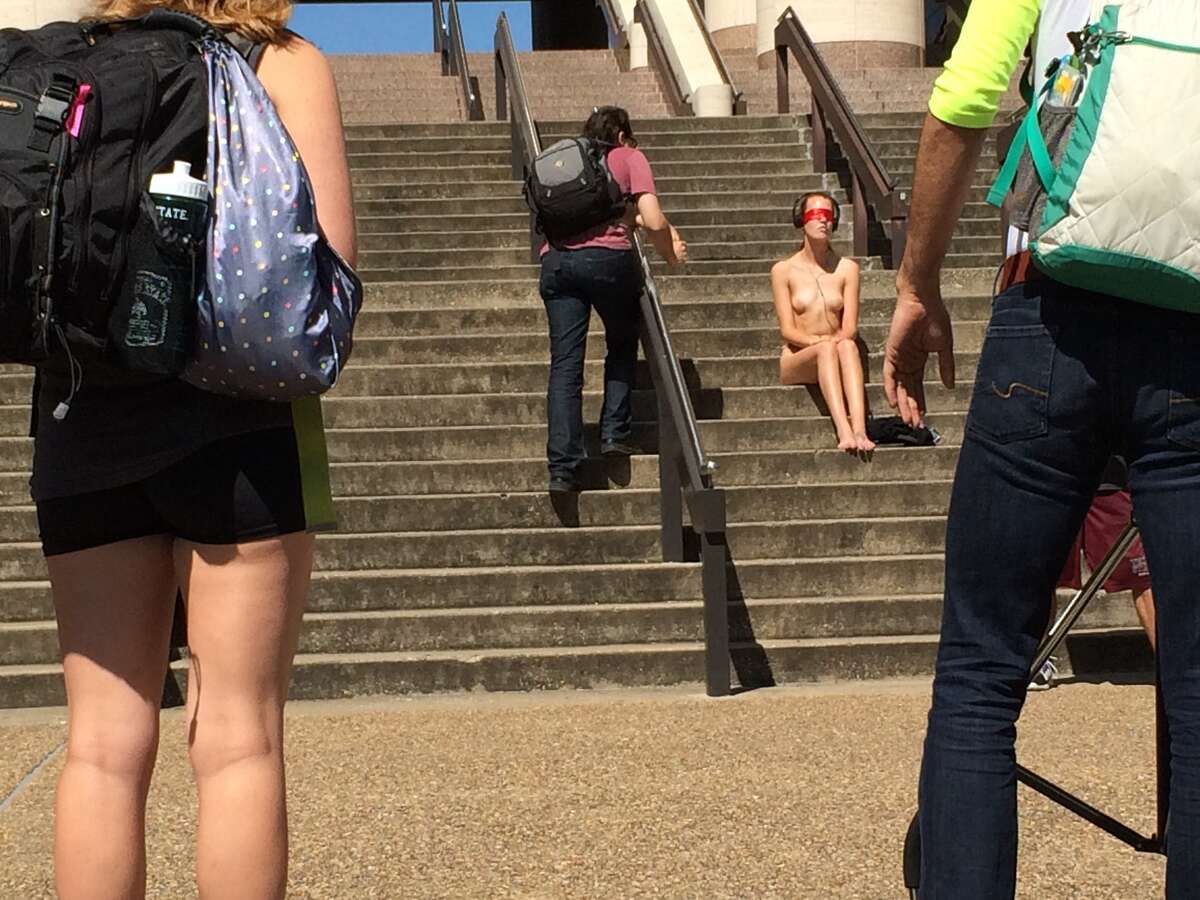 Naked Texas State student boldly sits outside school library, sends social media awry image