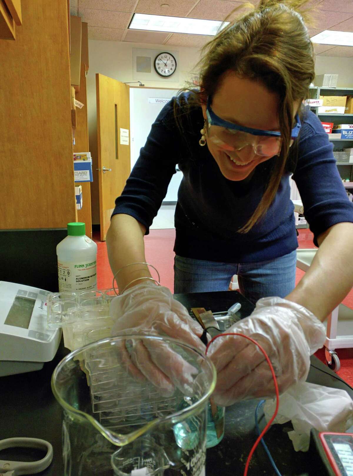 Science teacher Sarah Goldin does chemical voltage testing as part of research for a planned Innovation Lab project on solar energy.