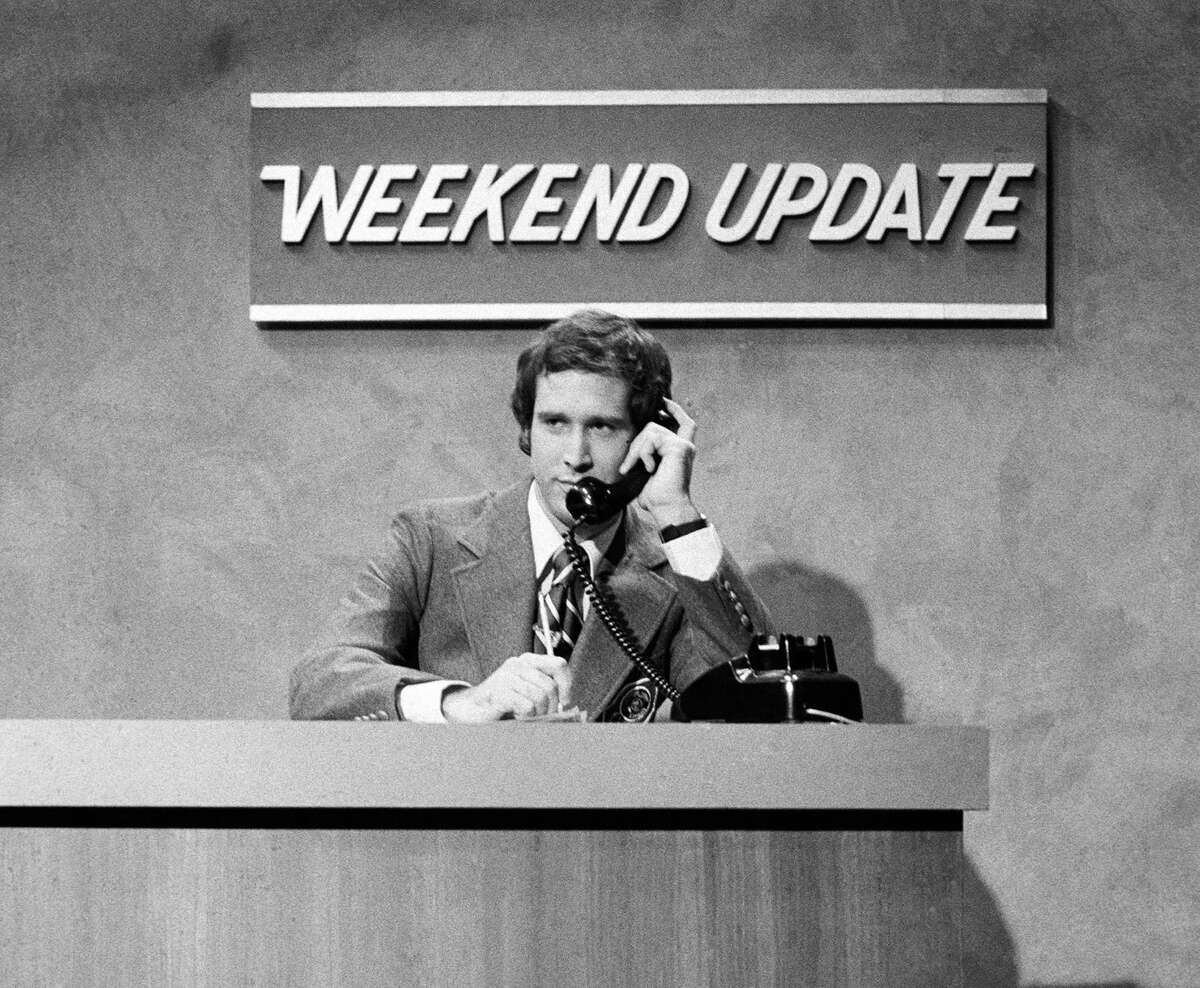 In this Oct. 11, 1975 photo released by NBC, Chevy Chase performs during a "Weekend Update" sketch on "Saturday Night Live," in New York. The long-running sketch comedy series will celebrate their 40th anniversary with a 3-hour special airing Sunday at 8 p.m. EST on NBC.
