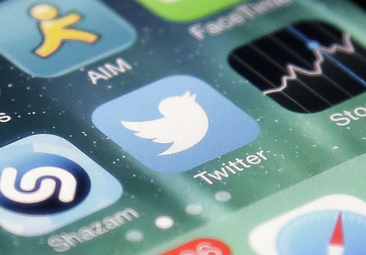 FILE - This Nov. 4, 2013 file photo shows the icon for the Twitter app on an iPhone in San Jose, Calif. Twitter Inc. reports quarterly financial results after the market closes Tuesday, April 28, 2015. (AP Photo/Marcio Jose Sanchez, File)