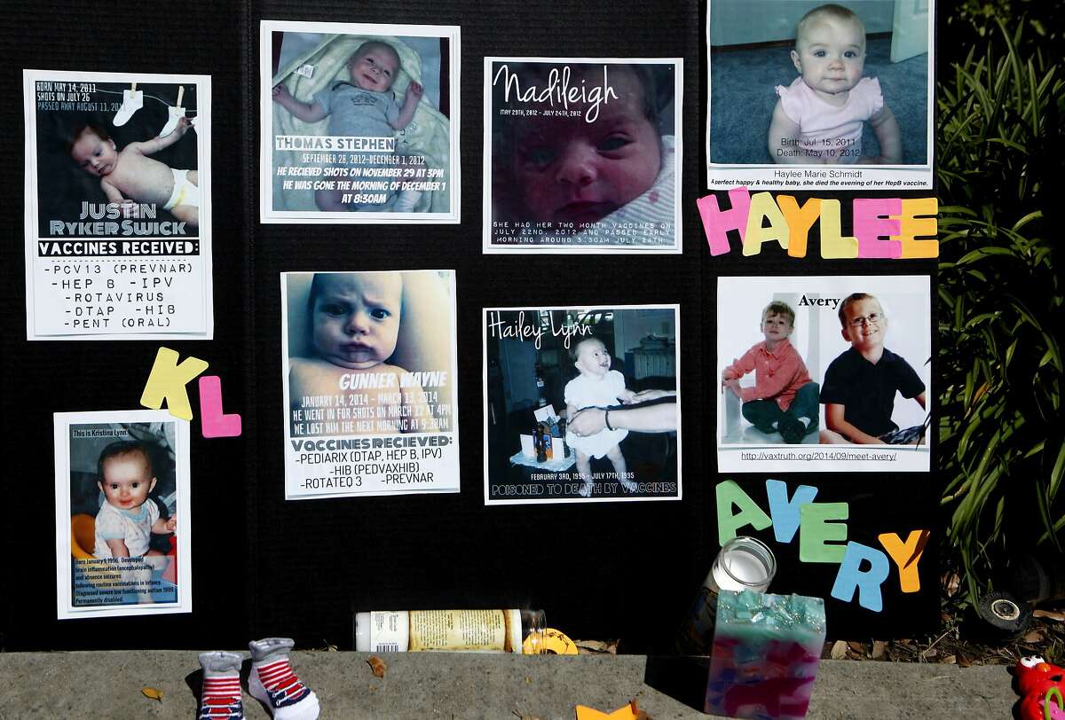 Pictures of children who died from vaccination complications are seen during a protest against SB277 before the Senate Judiciary Committee decision on the bill at the California State Capitol, Tuesday, April 28, 2015, in Sacramento, Calif. SB277 would eliminate the personal-belief exemption, the option California parents use to skip their child?•s school immunizations, but still allow children to be exempt for medical reasons.