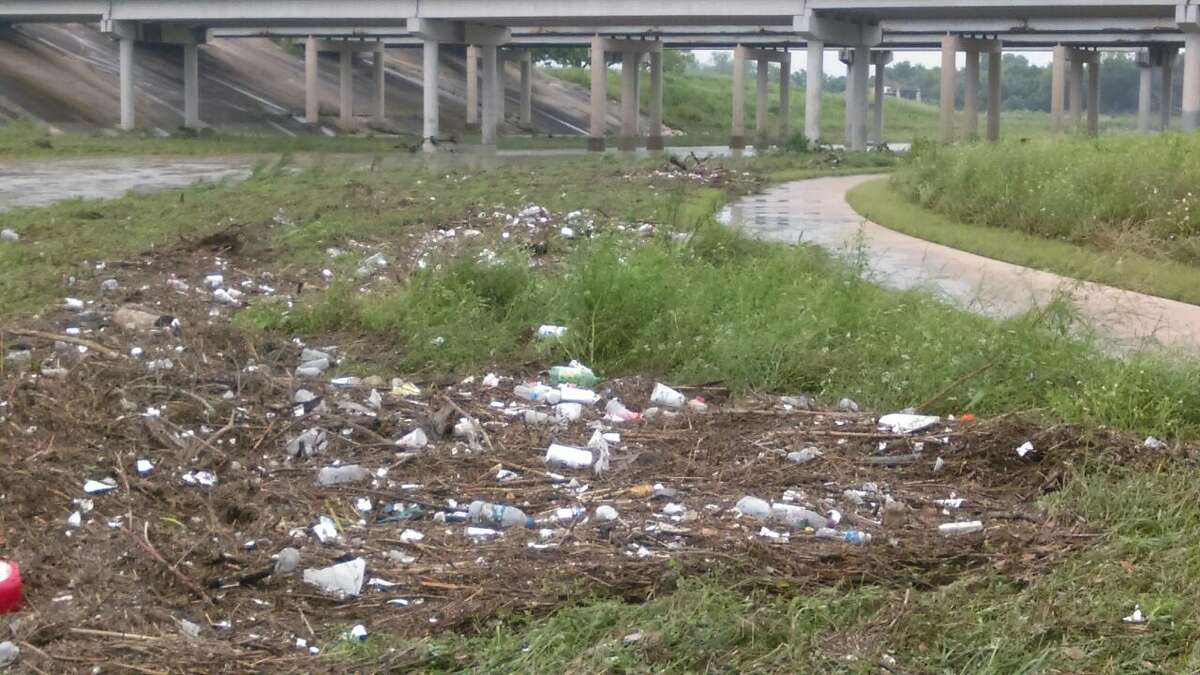 Garbage can be seen here scattered across the mission reach and the San Antonio River.