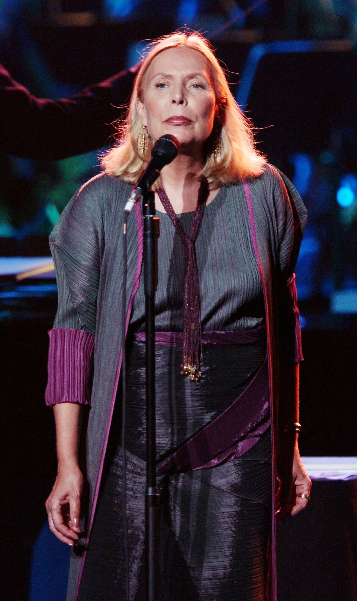 FILE MARCH 31, 2015: According to reports, singer Joni Mitchell was found unconscious at her home in Bel-Air, California on March 31, 2015 and was taken to the hospital. Mitchell is 71 years old. No further information regarding her health has been released at this time. LOS ANGELES - NOVEMBER 13: Recording Artist Joni Mitchell performs at the "Stormy Weather 2002" concert at the Wiltern Theatre on November 13, 2002 in Los Angeles, California. The annual event benefits the Walden Woods Project and the Thoreau Institute at Walden Pond. (Photo by Robert Mora/Getty Images)