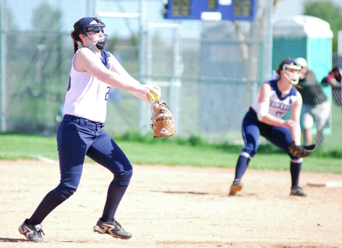 Staples pitcher Emily Lustbader fires a pitch during a game against Warde on Tuesday. The Wreckers lost 5-4.