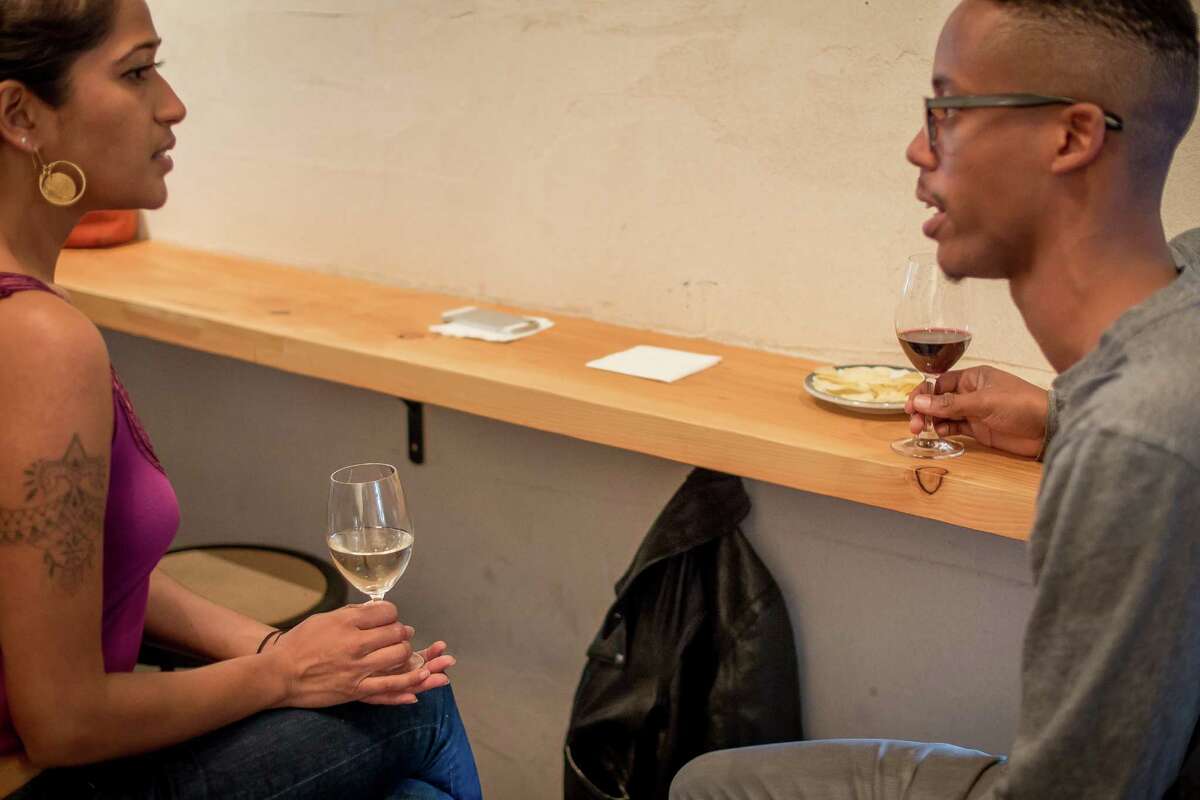 Cameron Drake has a glass wine with RoseMarie Maliekel at Birba in San Francisco, Calif., on April 28th, 2015.