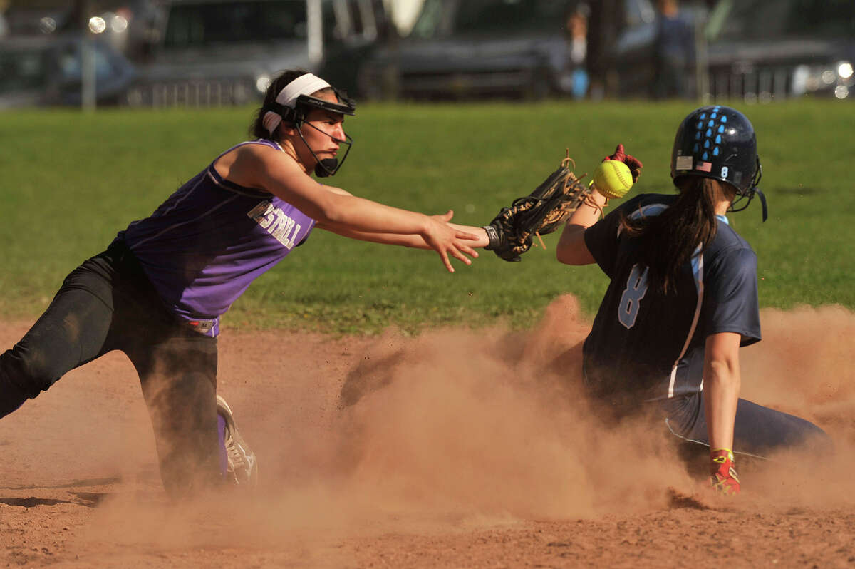 Westhill shortstop Gabby Laccona looses control of the ball as Wilton's Elizabeth Ward steals second base during their softball game at Westhill High School in Stamford, Conn., on Wednesday, April 29, 2015. Westhill won, 6-3.