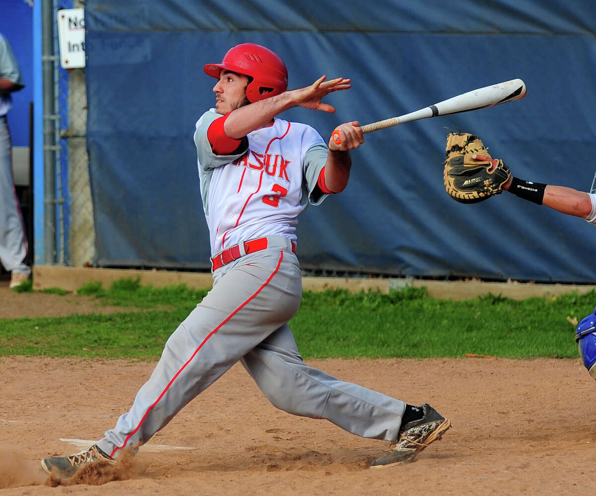 Masuk's Kyle Horton hits a double allowing two teammate to score in the sixth inning, during baseball action against Bunnell in Stratford, Conn. on Friday Apr. 17, 2015.