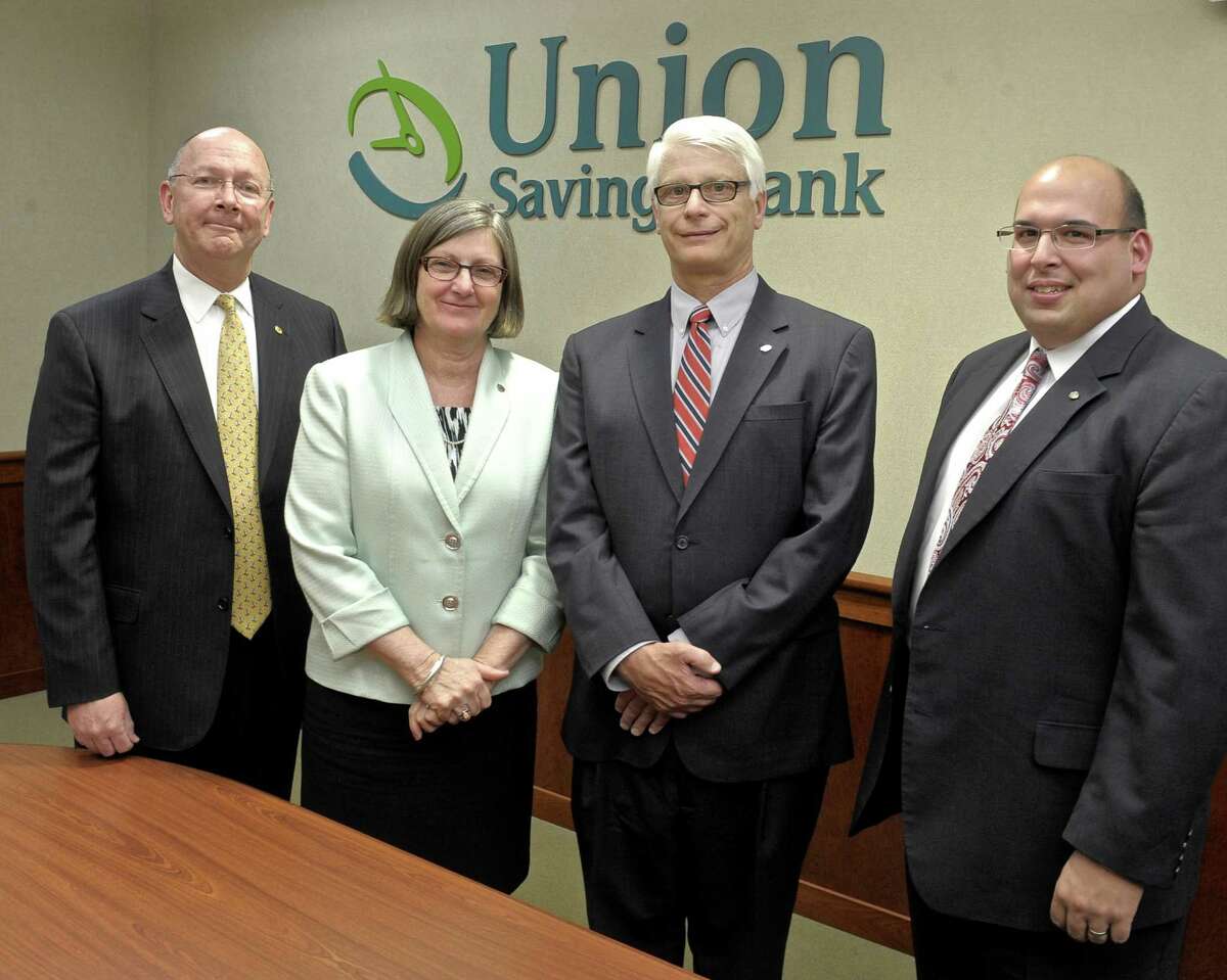 Joseph F. Morrissey, Senior Vice President, Head of Commercial Lending,left, Cynthia C. Merkle, President & CEO, Peter R. Maher, Executive Vice President, Chief Lending Officer and Vincent DiGilio, Vice President, Business Banking Manager at Union Savings Bank in Danbury, Conn, on Wednesday, April 29, 2015. The bank is striving to bring all the services needed for a small business through one contact, as part of their small business team initiative