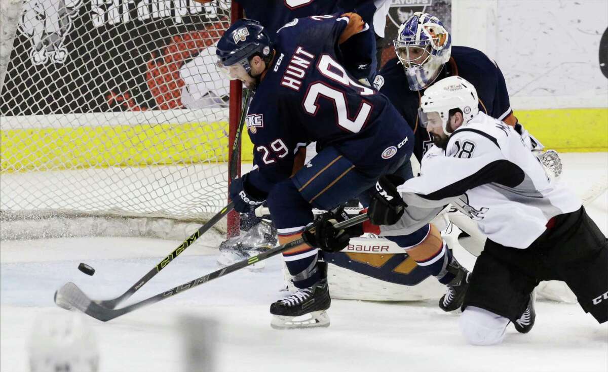 Rampage's John McFarland (18) attempts to score against Oklahoma City Baron's Brad Hunt (29) in the third period Game 3 of the Western Conference Quarterfinal series at the AT&T Center on Wednesday, Apr. 29, 2015. (Kin Man Hui/San Antonio Express-News)