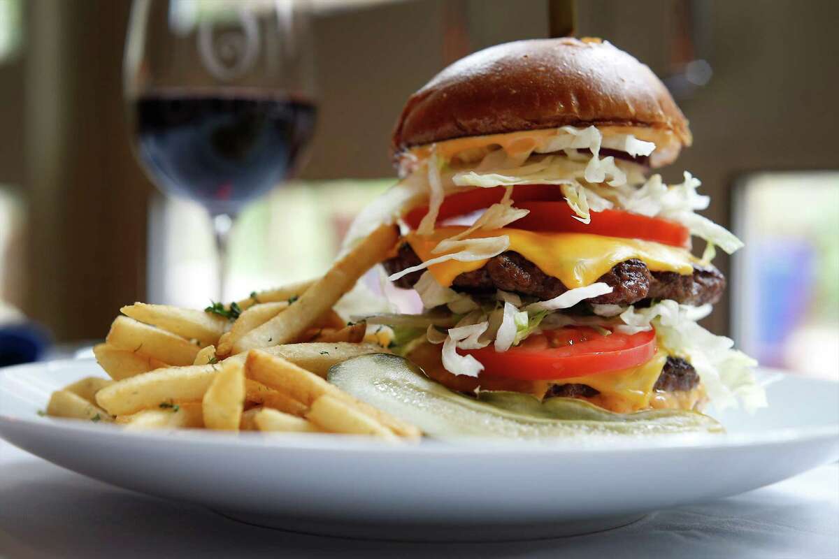 Image of a stacked cheeseburger for the review of Ostra, the signature restaurant at the Mokara Hotel & Spa, on Tuesday, Apr. 28, 2015. (Kin Man Hui/San Antonio Express-News)