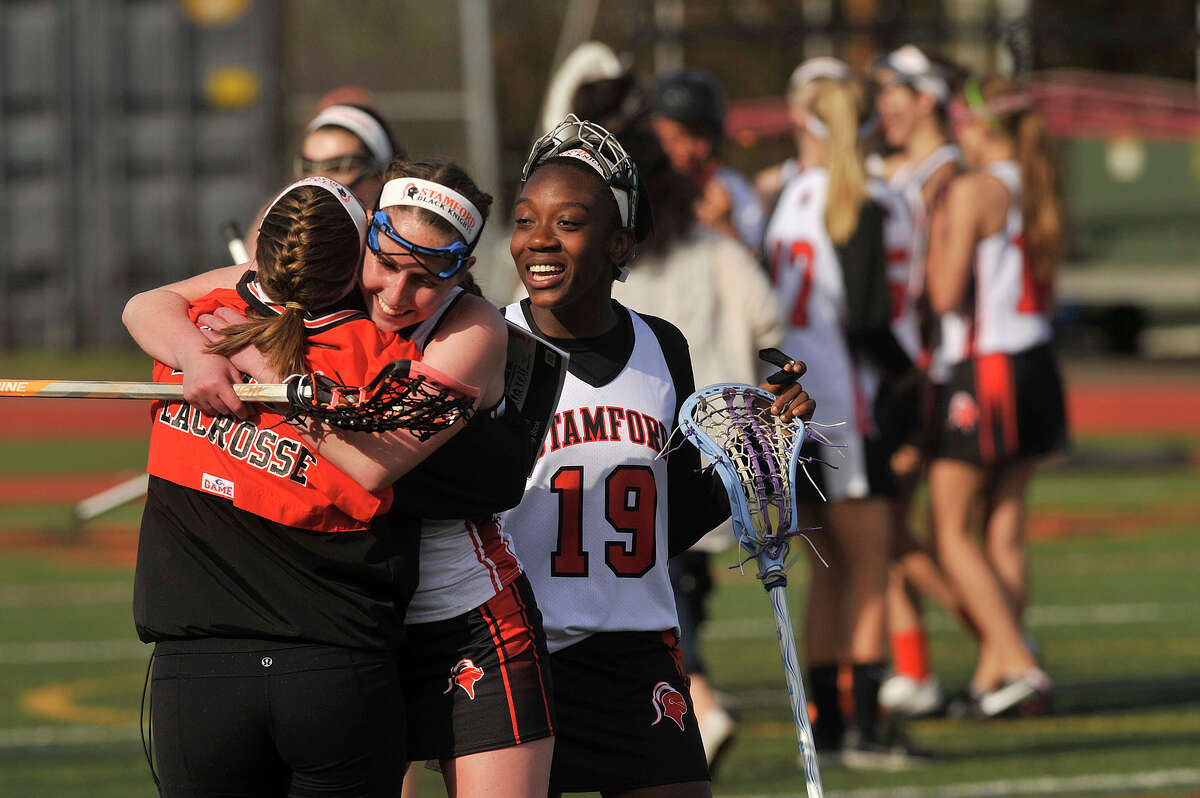 Stamford players celebrate after defeating Westhill, 14-0, following their lacrosse game at Stamford High School in Stamford, Conn., on Thursday, April 30, 2015.