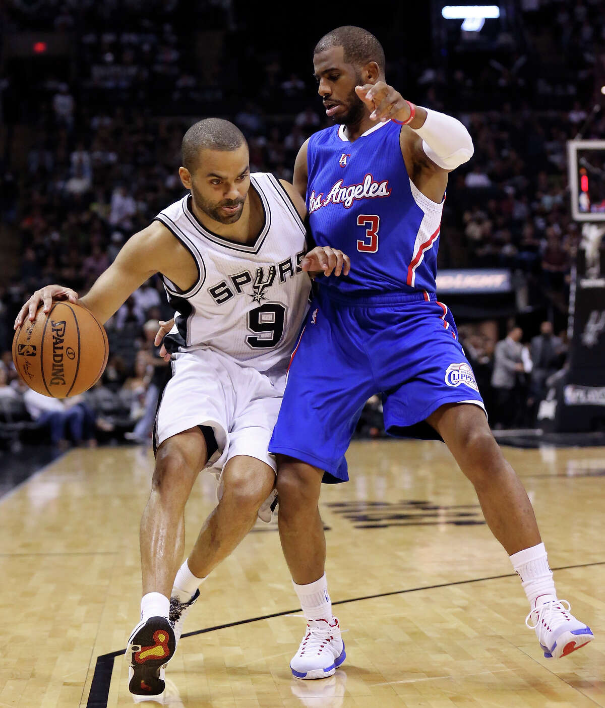 San Antonio Spurs’ Tony Parker looks for room around Los Angeles Clippers’ Chris Paul during second half action in Game 6 of the first round of the Western Conference playoffs Thursday April 30, 2015 at the AT&T Center. The Clippers won 102-96.