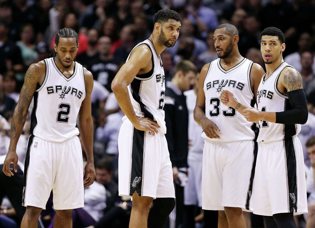 San Antonio Spurs' Kawhi Leonard (from left), Tim Duncan, Boris Diaw, and Danny Green pause during a timeout in Game 6 of the first round of the Western Conference playoffs against the Los Angeles Clippers Thursday April 30, 2015 at the AT&T Center. The Clippers won 102-96.