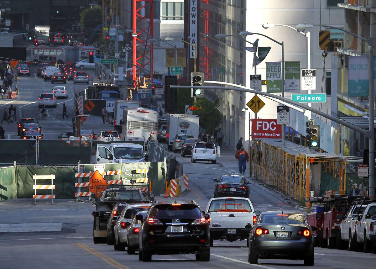 Commuters are funneled into a single lane past a construction site at Folsom and Fremont streets in downtown San Francisco, Calif. on Friday, May 1, 2015. Traffic has gotten worse due partly to numerous construction projects and the improving economy.